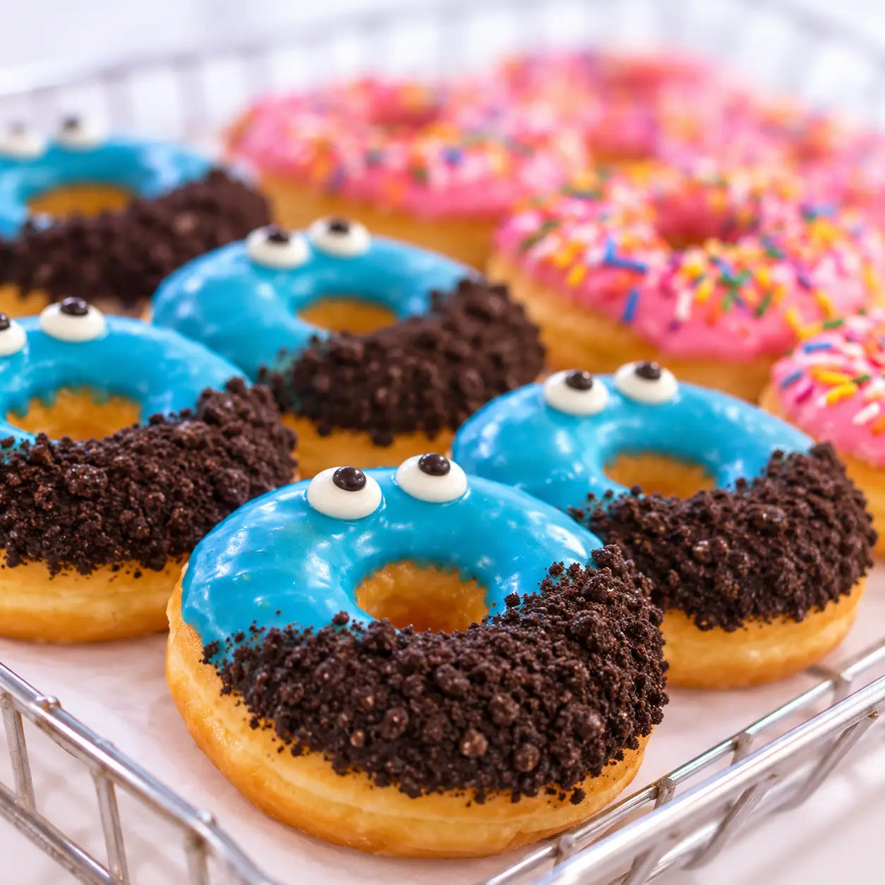 Blue and chocolate crumb donuts with playful candy eyes